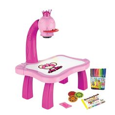 a pink children's table and chair set with markers, pencils, crayons and an animal hat