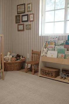 a baby's room with toys and books on the shelves