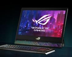 the asus gaming laptop is on display in front of a cityscape background