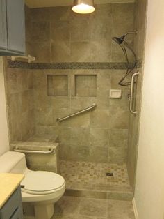 a bathroom with a toilet, shower and sink