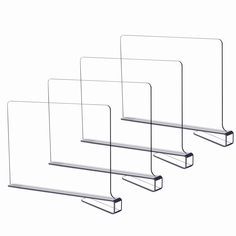 three metal shelfs with clear glass shelves on them