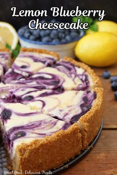 a lemon blueberry cheesecake on a wooden table