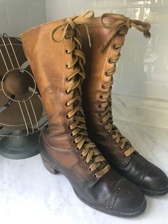 "Fabulous historical boots! Very small shoe size (possibly children's) on a boot that tells a story.  In my research, I found nothing exact and few that came close. This is truly a rare vintage find!  Consider these boots are more than 100 years old! Remarkable condition for the age of the boot.  Some sites claimed that these were Girl Scout boots, while others claimed Hiking Boots. Either way - they're pretty sweet!  Difficult to measure - I was unable to retrieve the inside measurements. Pictu Medieval Boots, Tall Lace Up Boots, Fishing Boots, Old Boots, Apocalyptic Fashion, Old Shoes, Hiking Boots Women, Vintage Boots, Girl Scout