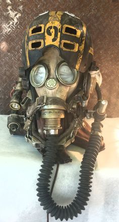 an old gas mask with goggles on it's head and earpieces