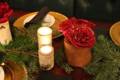 the table is set with candles and flowers