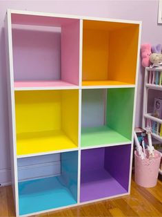 a multicolored bookcase in a child's room