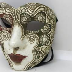 PLEASE WRITE YOUR TELEPHONE NUMBER WHEN YOU COMPLETE YOUR ORDER: Traditional and original papier-mache Venetian mask, handmade and decorated with acrylics colors. All our masks are handmade in our stores located in Venice. Our decorators use techniques typical of the Venetian tradition such as stucco, acrylics, gold and silver-leaf, macramè, passemenerie, pearls and crequelè to give you a wide range of masks. This shape is available in many different designs, colors and techniques. This mask is Venetian Half Mask, Artistic White Masquerade Mask, Artistic White Eye Mask For Masquerade, Artistic White Masks As Gifts, Artistic White Masks As A Gift, Hand-painted White Masks For Masquerade, Hand Painted White Mask For Masquerade, Hand Painted White Masks For Masquerade, Artistic White Eye Mask