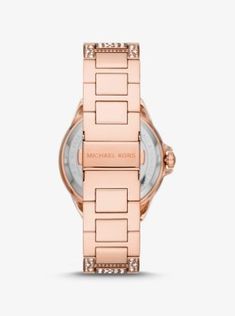 Our oversized Camille watch strikes the perfect balance between bold and elegant. Featuring allover pavé accents in a stingray-inspired pattern this modern rose gold-tone timepiece boasts sleek time stops and pavé-embellished subdials for added glamour. Wear it with everything from casual-cool ensembles to office-ready separates. Rose Gold Diamond Watch With Round Dial For Evening, Michael Kors Diamond Metal Watch, Modern Rose Gold Watch For Evening, Modern Rose Gold Evening Watch, Evening Rose Gold Quartz Watches, Michael Kors Rose Gold Watch With Subdials, Michael Kors Diamond Watch With Round Dial, Modern Michael Kors Watch With Diamond Hour Markers, Modern Michael Kors Watches With Diamond Hour Markers