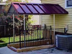 an outside view of a house with a metal roof