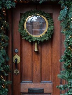 a christmas wreath is hanging on the front door