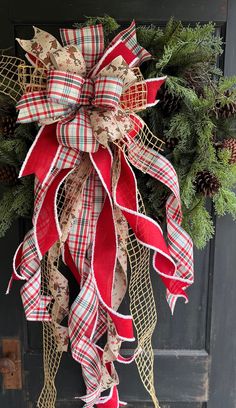 a christmas wreath hanging on the front door