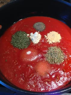 a pan filled with sauce and spices on top of a counter