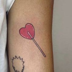 a heart shaped lollipop on the arm