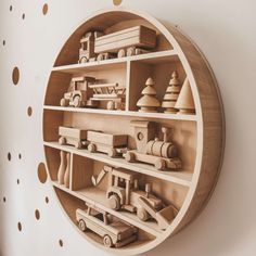 wooden toys are arranged in a circular shelf