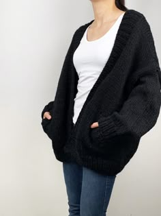 "New design for this winter! Oversize cardigan gives you cozy feel and stylelish looking! Feastures: * open front cardigan with side pockets * oversize looking * drop-shoulder sleeves * 70% wool / 30% acrylic chunky blended yarn - soft and no itchy at all Size: S(us 0-4) M(us 6-8) L(us 10-12)XL(14-16). Pls. choose size and color options. Size Measurements: S: chest 47\"(120cm), length -26\"(65cm) M: chest - 51\"(130cm) length - 27\" (68cm) L: chest 55\"(140cm), length- 28\"(70cm) XL: chest 59\"( Chunky Black Cardigan Outfit, Black Chunky Cardigan, Black Knitted Cardigan Outfit, Oversized Cardigan With Pockets For Cold Weather, Oversized Knitted Sweater Coat For Cold Weather, Relaxed Fit Chunky Knit Sweater Coat For Winter, Oversized Cozy Cardigan With Pockets, Cozy Oversized Cardigan With Pockets, Oversized Knitted Cardigan For Everyday