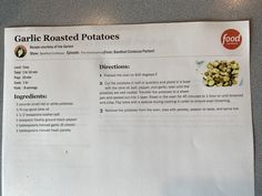 a menu listing garlic roasted potatoes on a table