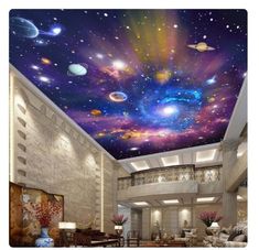 the ceiling is decorated with colorful stars and planets