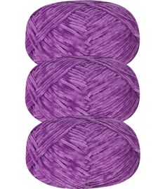 three skeins of yarn in purple colors on a white background with clipping for text