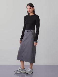 This product is a belted long skirt that exudes sophistication and modern style. The high-waisted design is accentuated with a belt, offering both elegance and a flattering fit. - The skirt features a sleek, straight cut that falls to mid-calf, providing a streamlined silhouette.- A built-in belt cinches at the waist, enhancing the skirt’s tailored appearance.- Made from a smooth, structured fabric, the skirt holds its shape while allowing for ease of movement.- Perfect for professional settings or dressy occasions, this skirt pairs effortlessly with both fitted and loose tops. Elegant Relaxed Skirt With Belt, Midi Length Skirt With Belt Loops, Fall Workwear Skirt With Belt Loops, Fall Flared Skirt With Belt Loops, Elegant Skirt With Belt, Workwear Skirt With Belt Loops And Relaxed Fit, Workwear Skirt With Belt Loops, Elegant Belted Skirt For Spring, Elegant Spring Skirt With Belt Detail