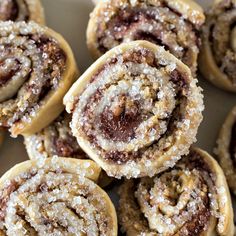 several cinnamon rolls are stacked on top of each other