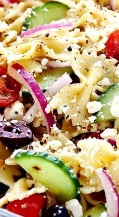 pasta salad with cucumbers, tomatoes, onions and feta cheese