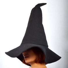 Luxurious witch or sorcerer's hat made of high quality dense cotton fabric. There is a black cotton lining inside. Рleasant softness, it retains well the shape that you want to give it. Sharp top, curved top, lowered or flat brim are all possible. This hat is ideal for costumes and every-day sorcery alike. In addition, it can be washed in warm water and ironed with a steam generator. Looks great with cardigans, coats and cloaks. Hat height - 41 cm / 16 inches Brimmed Diameter - 42 cm / 16.5 inch Fitted Black Witchy Hat, Black Fitted Witchy Hat, Black Gothic Hat For Cosplay, Black Wide Brim Costume Hat For Cosplay, Witchy Black Brimmed Costume Hat, Black Witchy Brimmed Costume Hat, Black Brimmed Witchy Costume Hat, Black Witchy Brimmed Hat, Black Cotton Halloween Hat