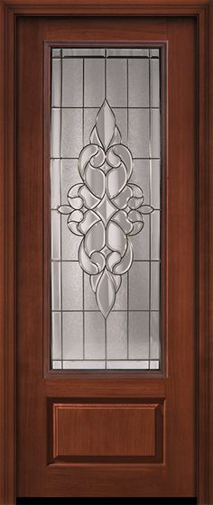 a wooden door with stained glass panels and a decorative design on the front side panel