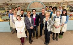 a group of people in aprons posing for a photo