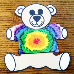 a paper cut out of a teddy bear with a tie - dyed t - shirt