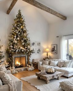 a living room filled with furniture and a christmas tree in the middle of the room