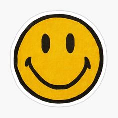 a yellow smiley face sticker with black outline on the bottom, and one eye open