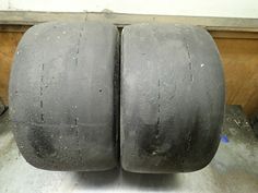 two large tires sitting on top of a metal table