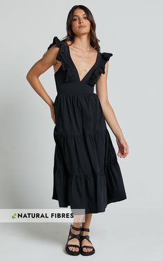 Get ready to turn heads in the Levona Midi Dress. This stunning black A-line dress is perfect for any occasion, whether you're dressing up for a party or keeping it casual for a day out with friends. The ruffle shoulder detail adds a touch of femininity and the tiered skirt creates a flattering silhouette that accentuates your curves. Made from 100% cotton, this dress is not only comfortable but also breathable, making it ideal for warmer weather. With its V-neckline and short sleeves, the Levon Vestidos Para Baby Shower, Cotton Dress Fabric, Dress Cotton, Tiered Skirt, Tiered Dress, Ruffle Dress, Midi Length, A Line Dress, Casual Dresses