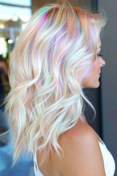 Icy Blonde With Peekaboo Color, Short Hair Color Ideas For Blondes, Platinum Blonde Hair With Rainbow Highlights, Colorful Hair For Blondes, Irredescent Hair, Blonde With Vivid Highlights, Pastel Vivid Hair Color, Pink Money Piece Hair With Bangs, Oil Slick Hair Color Blonde