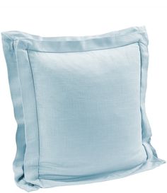 a light blue pillow on a white background