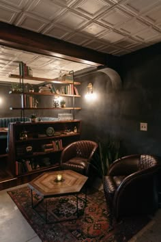 a living room with two leather chairs and a coffee table