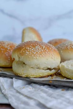 sesame seed bagels on a baking sheet