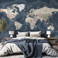 a bedroom with a large world map on the wall and bed in front of it