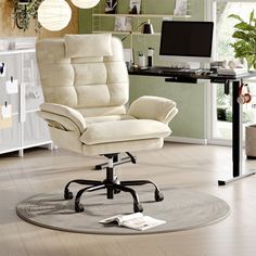 a white office chair sitting on top of a hard wood floor next to a computer desk