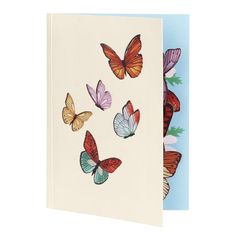 a greeting card with colorful butterflies on it