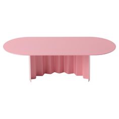 a pink table with pleated edges on the top and bottom, against a white background