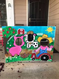 an outdoor play area painted with farm animals