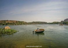 a person in a small boat on the water