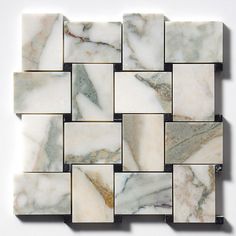 a white and black marble mosaic tile pattern