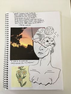 an open notebook with drawings and notes on the pages, including a drawing of a woman's face