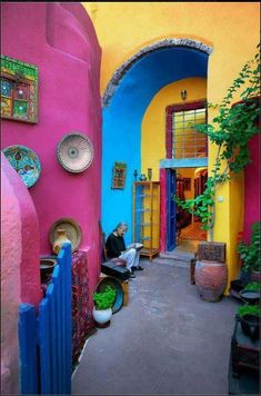 the front cover of a magazine with an image of colorful houses and doorways in different colors