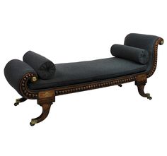 an old fashioned chaise lounge is upholstered