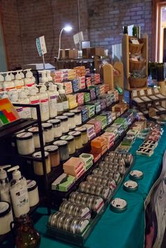 a table filled with lots of different types of soaps and lotions on it