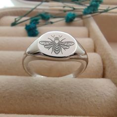 "Item details Handmade ➤PRODUCT DETAILS * Material: 925 Sterling Silver 10 mm Round Shape Signet Ring * Finish: Silver, Rose Gold Filled, Yellow Gold * Size: All sizes from 4 US to 12 US are available. Please write your desired size to personalization box at check out. Personalized  silver Bee signet ring customized with bee.. A unique personalized gift for women, bridesmaid gift... The ring is also available in silver, rose gold or yellow gold. Please select it during check out. Your signet  ➤P Bee Images, Bee Lover Gifts, Bee Ring, Engraved Ring, Bee Jewelry, Unique Personalized Gift, Gifts Personalized, Engraved Rings, Ring Sterling Silver