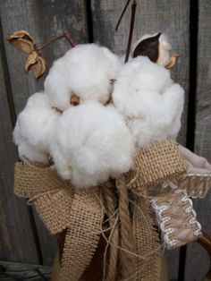 cotton in a vase with burlocks and twine